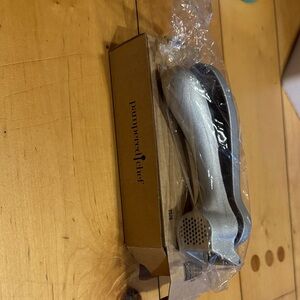 Brand new- Pampered Chef Silver Garlic Press